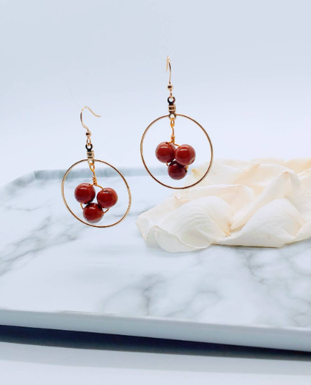 Red hoop earrings